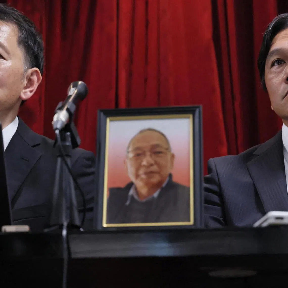 The family of Mr Shizuo Aishima (centre), who was falsely accused of unauthorised export of sensitive equipment and died after prolonged detention, is seeking 170 million yen (S$1.37 million) in damages. 
