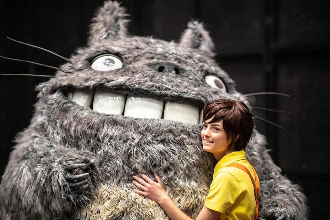 Sweden's Henrik Pilerud, inside the Totoro costume, and his team member Victoria Christensen pose at the World Cosplay Summit in Nagoya on August 3, 2024