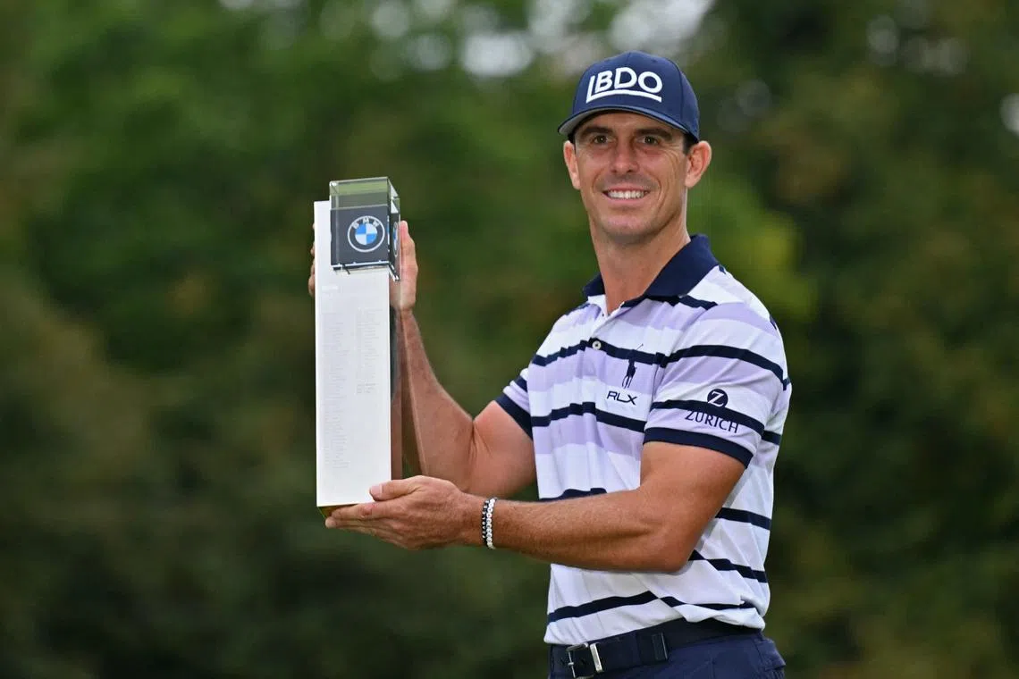 US golfer Billy Horschel poses with the trophy after his victory in the BMW PGA Championship at Wentworth Golf Club.