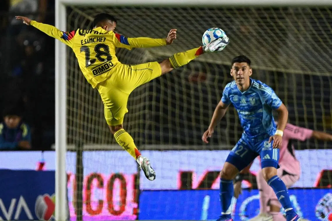 America's midfielder Erick Sanchez (L) kicking the ball next to Tigres' defender Jesus Angulo during the Liga MX Clausura tournament football match between America and Tigres at the Ciudad de los Deportes Stadium in Mexico on March 1, 2026. 