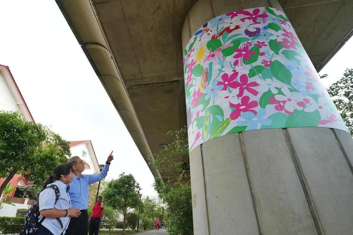 Unveiling of new Art under Viaduct Spaces project, "Trainforest" at Kembangan MRT. Associate Professor Faishal Ibrahim, Acting Minister-in-charge of Muslim Affairs and Senior Minister of State, Ministry of Home Affairs speaking to 郭慧欣, about her artwork