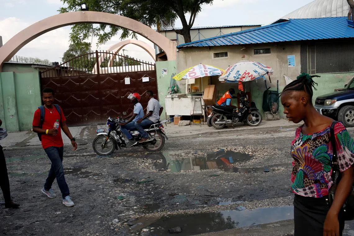 FILE PHOTO: People walk past Bernard Mevs Hospital in Port-au-Prince, Haiti, March 27, 2019. REUTERS/Andres Martinez Casares/File Photo