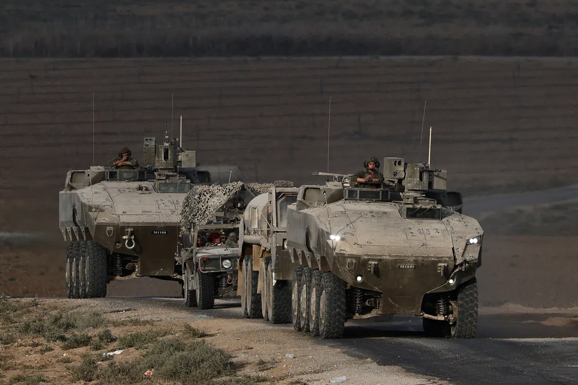 An Israeli military convoy manoeuvres on Israeli side of the Israel-Gaza border, in Israel, September 21, 2025. REUTERS/Amir Cohen/File Photo