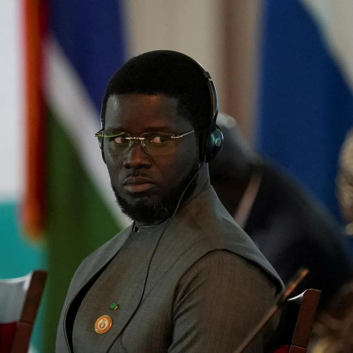 Senegal's President Bassirou Diomaye Diakhar Faye reacts during the Economic Community of West African States (ECOWAS) 67th Ordinary Session of the Authority of Heads of State and Government in Abuja, Nigeria, June 22, 2025. REUTERS/Marvellous Durowaiye