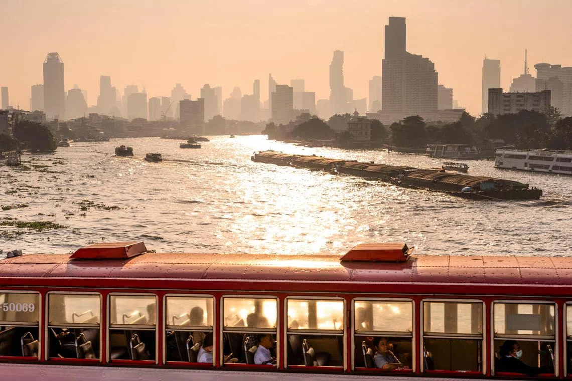 A bus crossing a bridge over the Chao Phraya river amid high air pollution levels in Bangkok, Thailand on Jan 21, 2025. 
