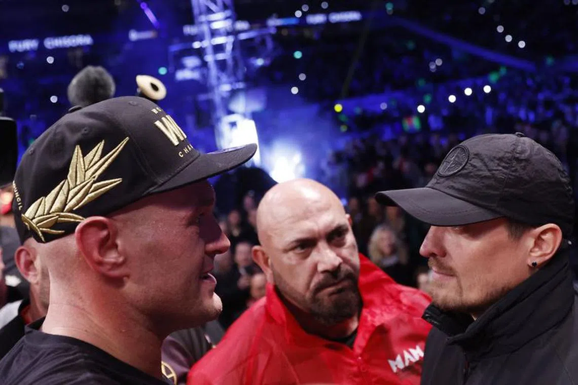 FILE PHOTO: Boxing - WBC World Heavyweight Title - Tyson Fury v Derek Chisora - Tottenham Hotspur Stadium, London, Britain - December 3, 2022  Tyson Fury with Oleksandr Usyk after the fight Action Images via Reuters/Andrew Couldridge