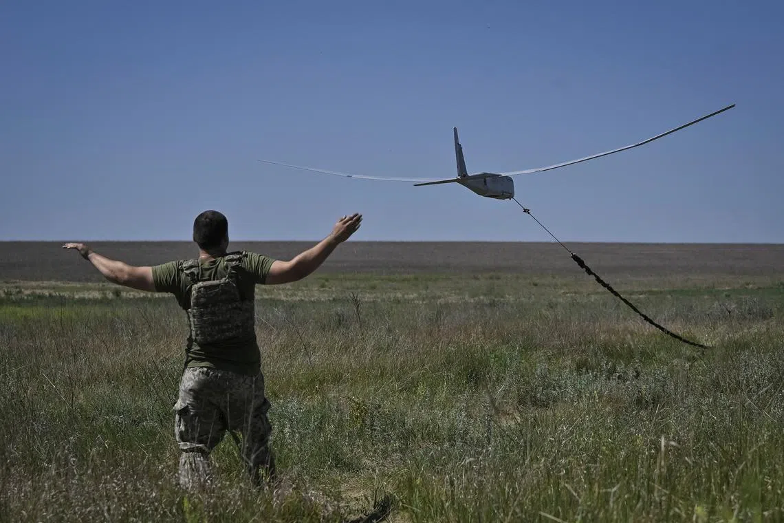 A Ukrainian serviceman launches a reconnaissance drone in Donetsk region, Ukraine, on June 13.