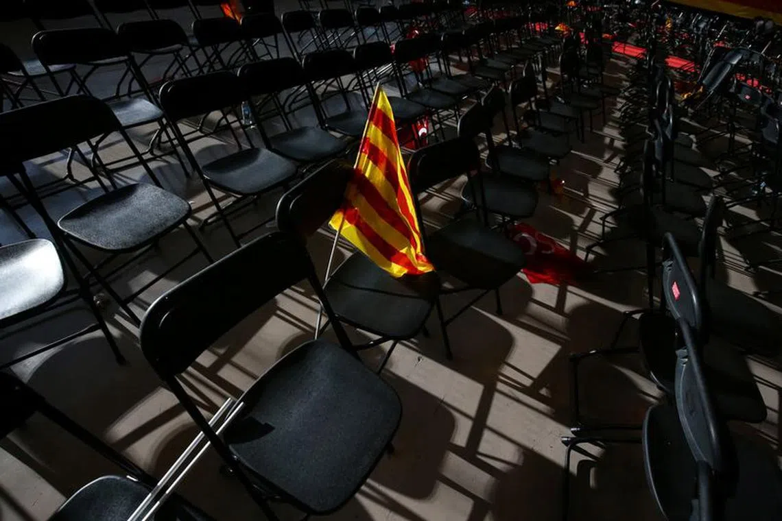 A Senyera (Catalan flag) is seen on chair after a Socialist Party of Catalonia (PSC) meeting in Barcelona, Spain, December 17, 2017. REUTERS/Albert Gea/File Photo