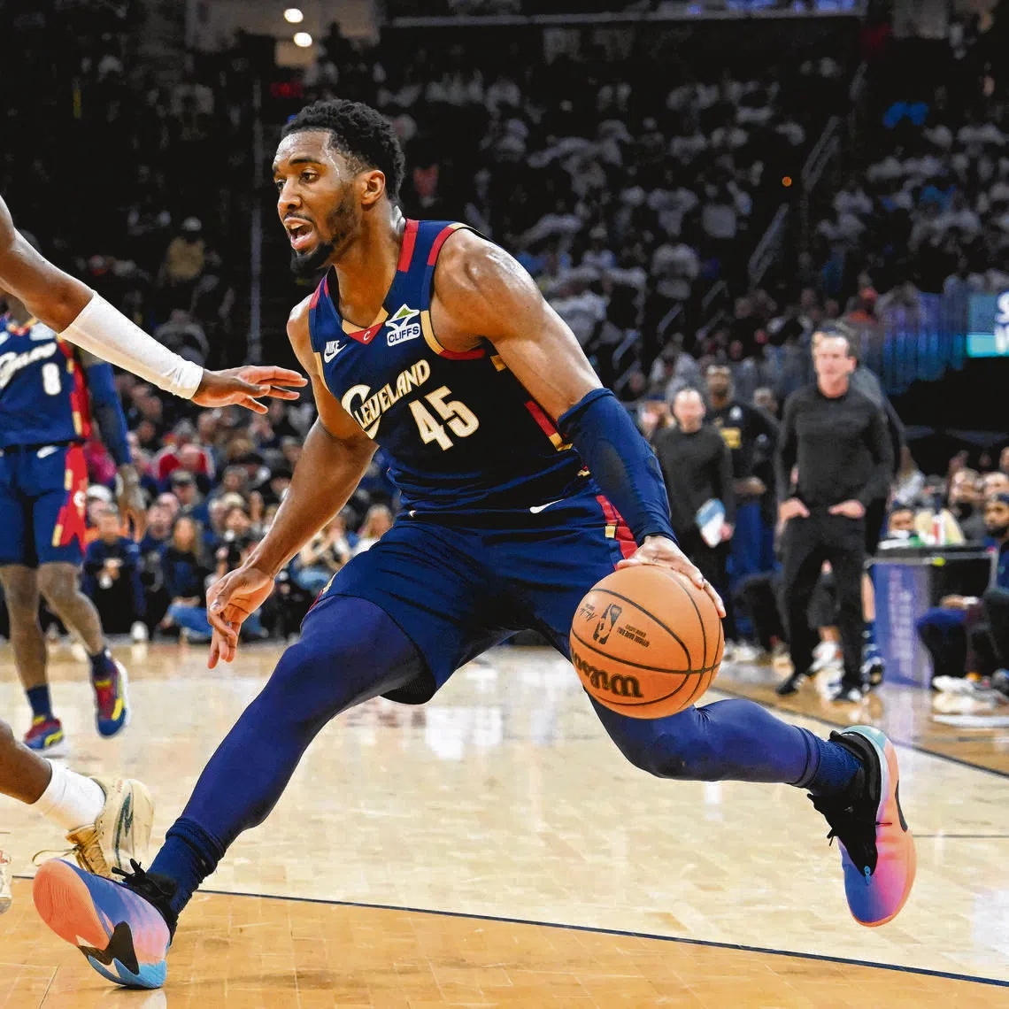 Donovan Mitchell of the Cleveland Cavaliers drives against Caris LeVert of the Detroit Pistons during the fourth quarter in Game 4.