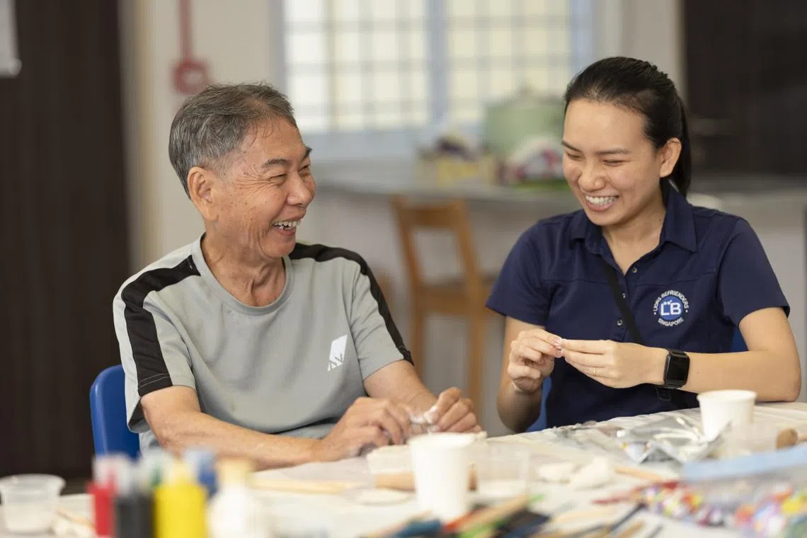 leong shiuan wen from lions befrienders engage seniors like lee khiok ek at active ageing centres in singapore through various activities, from arts and crafts to social gatherings