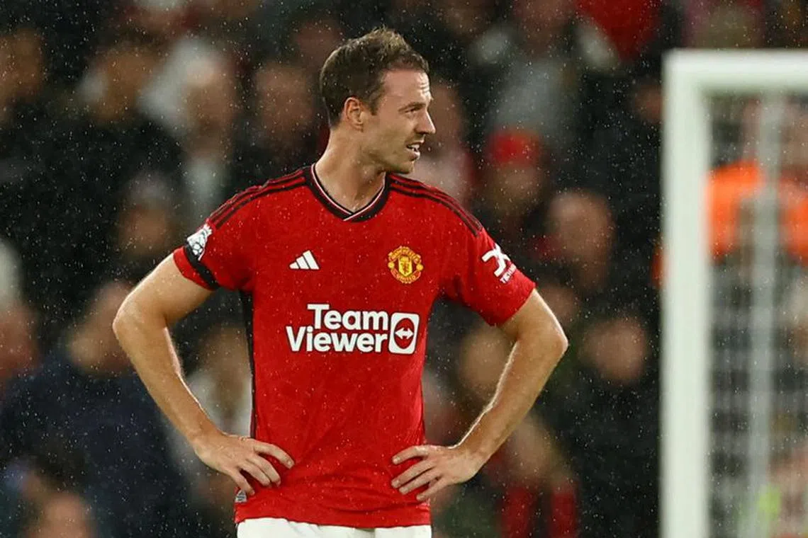 Soccer Football - Premier League - Manchester United v Manchester City - Old Trafford, Manchester, Britain - October 29, 2023  Manchester United's Jonny Evans reacts after Manchester City's Phil Foden scores their third goal REUTERS/Molly Darlington/File Photo
