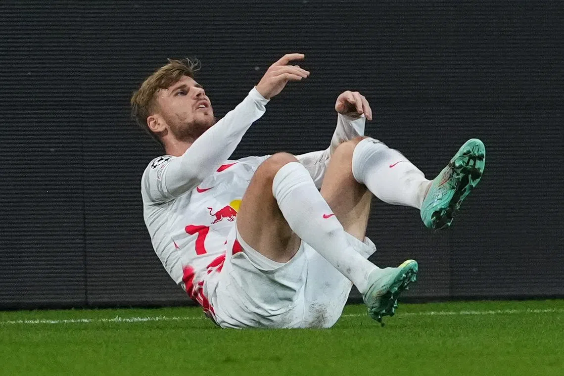 RB Leipzig's Timo Werner goes down injured against Shakhtar Donetsk in the Champions League.