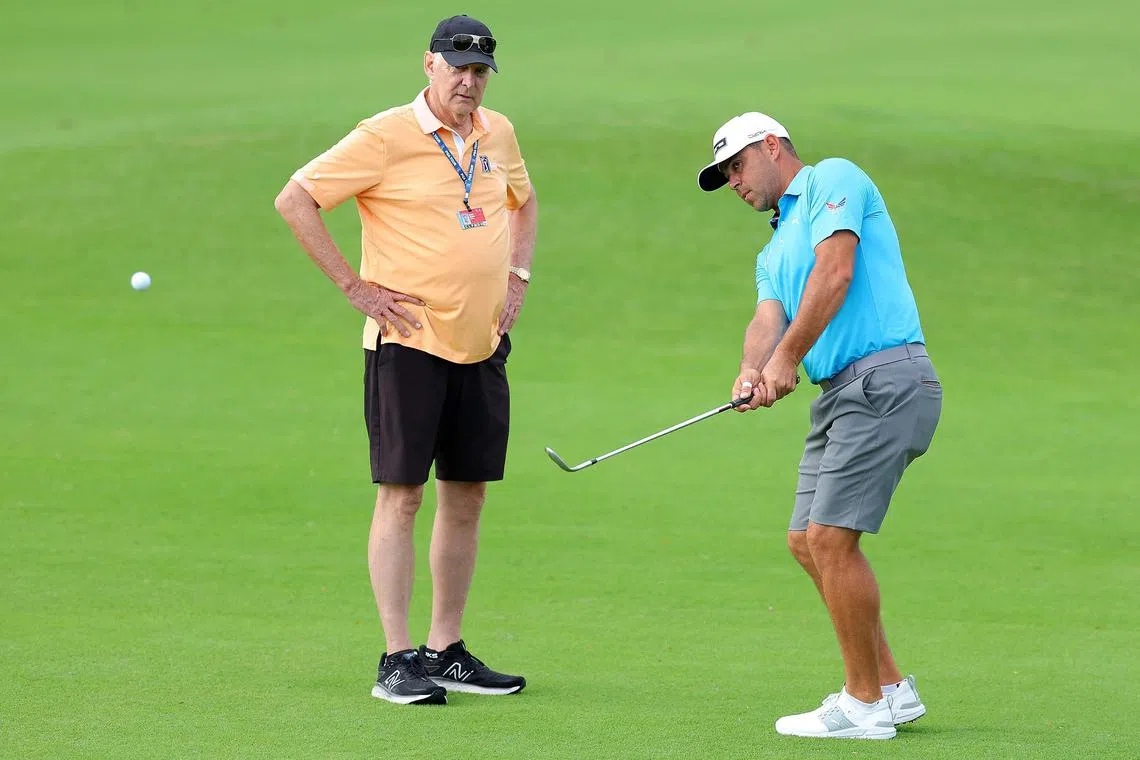 Gary Woodland chips on the 10th hole during a practice round prior to the Sony Open in Hawaii.