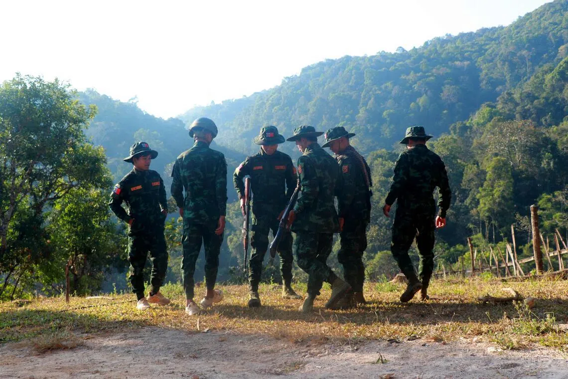 Fighters from Myanmar’s rebel Kayan National Army standing guard around their base camp in Pekon, in Shan state, on Jan 25.