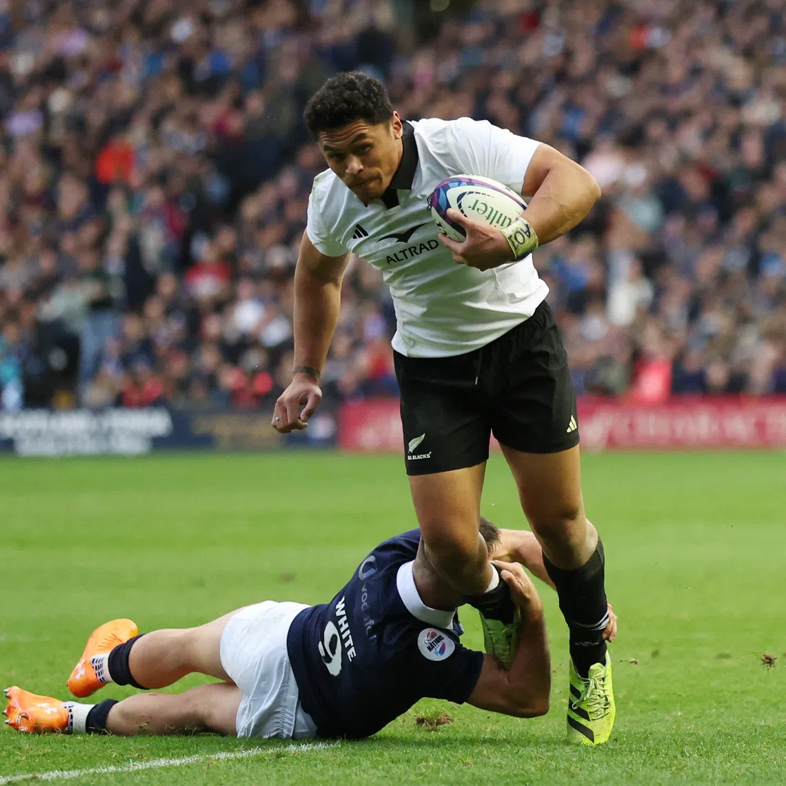 Rugby Union - Autumn Internationals - Scotland v New Zealand - Murrayfield Stadium, Edinburgh, Scotland, Britain - November 8, 2025 New Zealand's Caleb Clarke in action with Scotland's Ben White REUTERS/Russell Cheyne