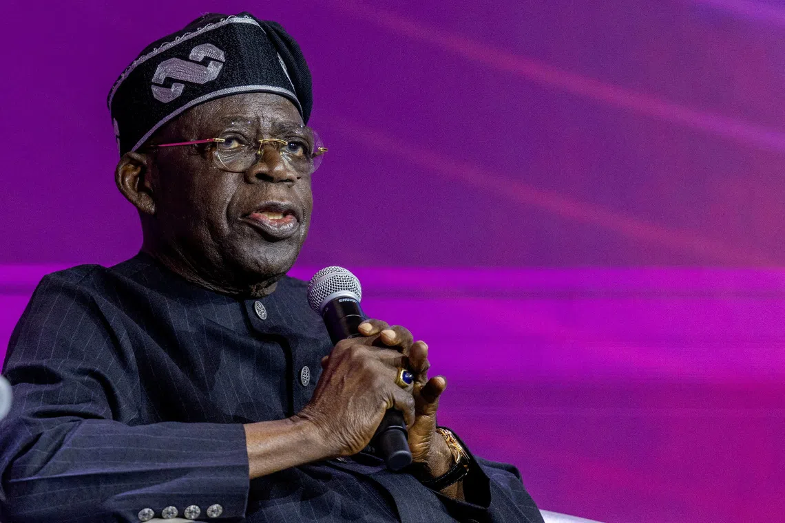 FILE PHOTO: Nigeria's president Bola Tinubu attends a panel discussion during the Africa CEO forum under the theme “The Scale Imperative: Why Africa Must Embrace Shared Ownership,” at the Kigali Convention Centre in Kigali, Rwanda, May 14, 2026. REUTERS/Jean Bizimana/File Photo