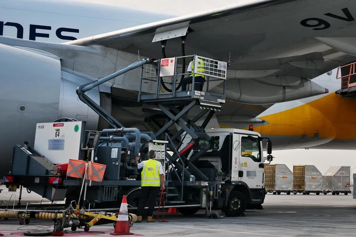 ST20250807_202521200683 Kua Chee Siong/ yfsaf07/
The Boeing 777 freighter, sporting a dual DHL-Singapore Airlines (SIA) livery, undergoing refueling at the airside area of the Changi AirFreight Centre, on Aug 7, 2025.
DHL Express and sustainable aviation fuel producer Neste are hosting a joint visit for the media to Changi Airport's airside and DHL South Asia Hub, with a show-and-tell on aircraft refuelling and a tour of DHL's facility.
