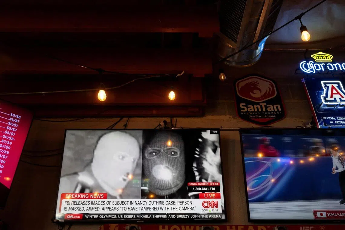 The photos released by US officials show a person wearing a face mask, gloves, backpack and what appears to be a gun holster.