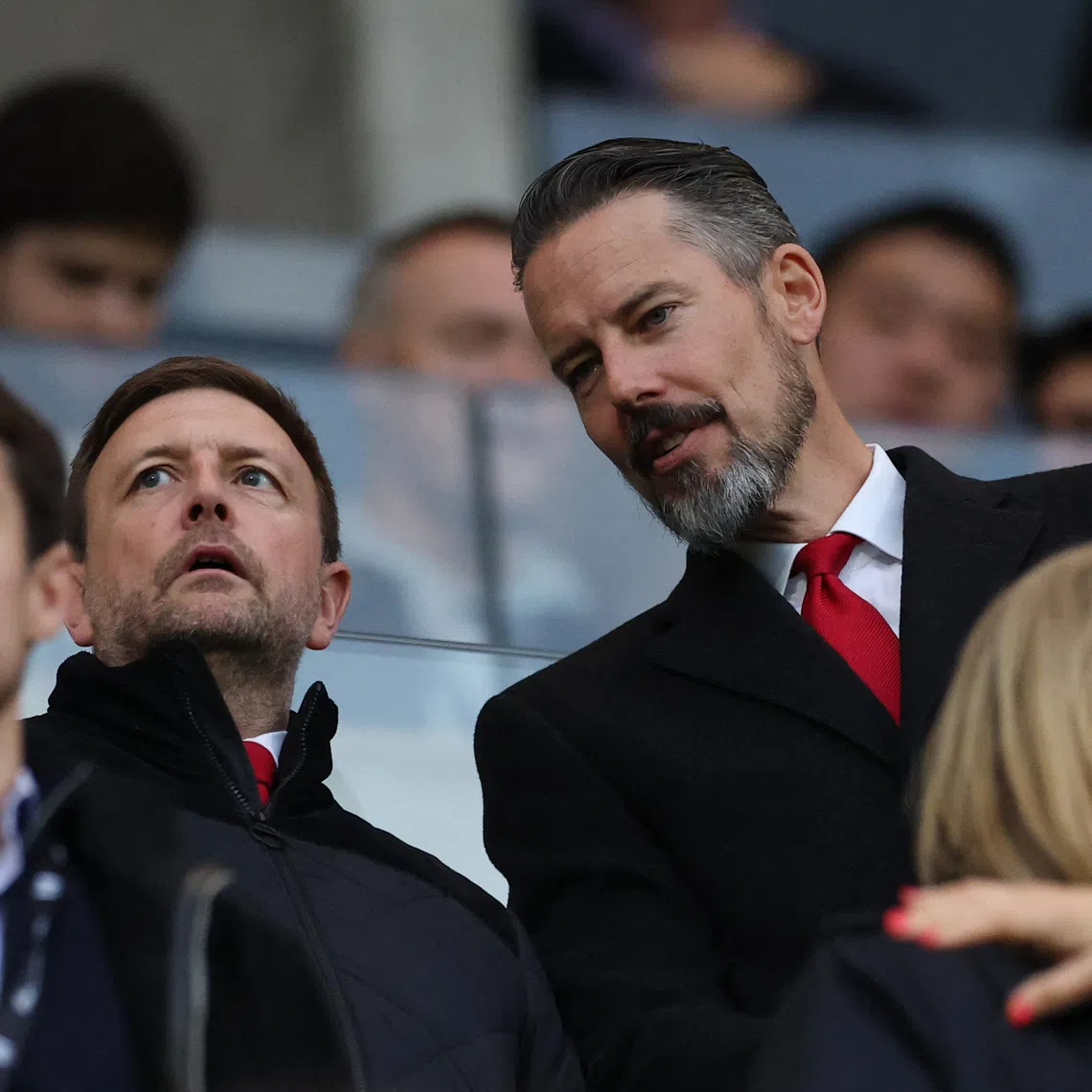 Arsenal CEO Richard Garlick (second from left) and co-chair Josh Kroenke (right) in the stands before an English Premier League match.