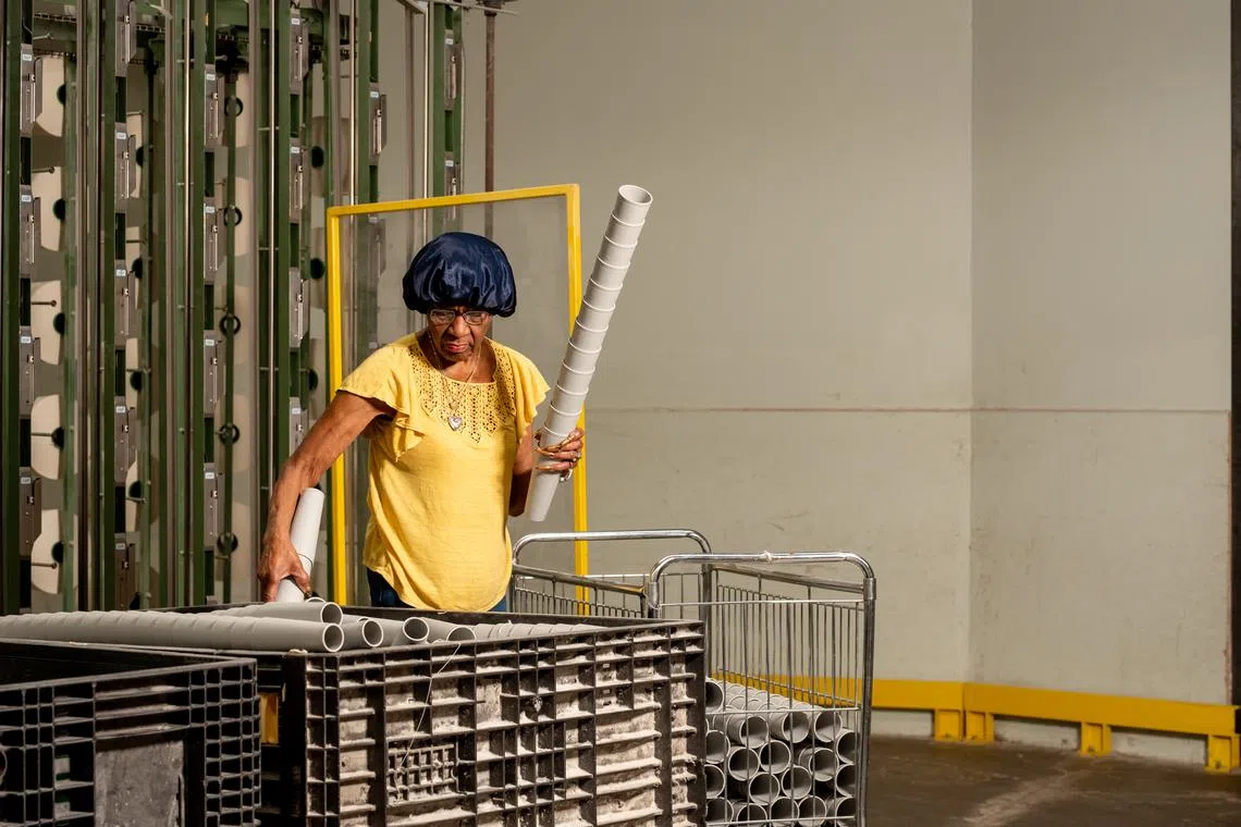 An employee works at Greenwood Mills in Greenwood, South Carolina, on June 6.