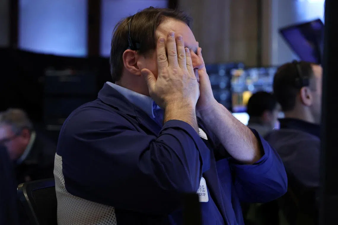 A trader reacts on the floor of the New York Stock Exchange, in New York City.