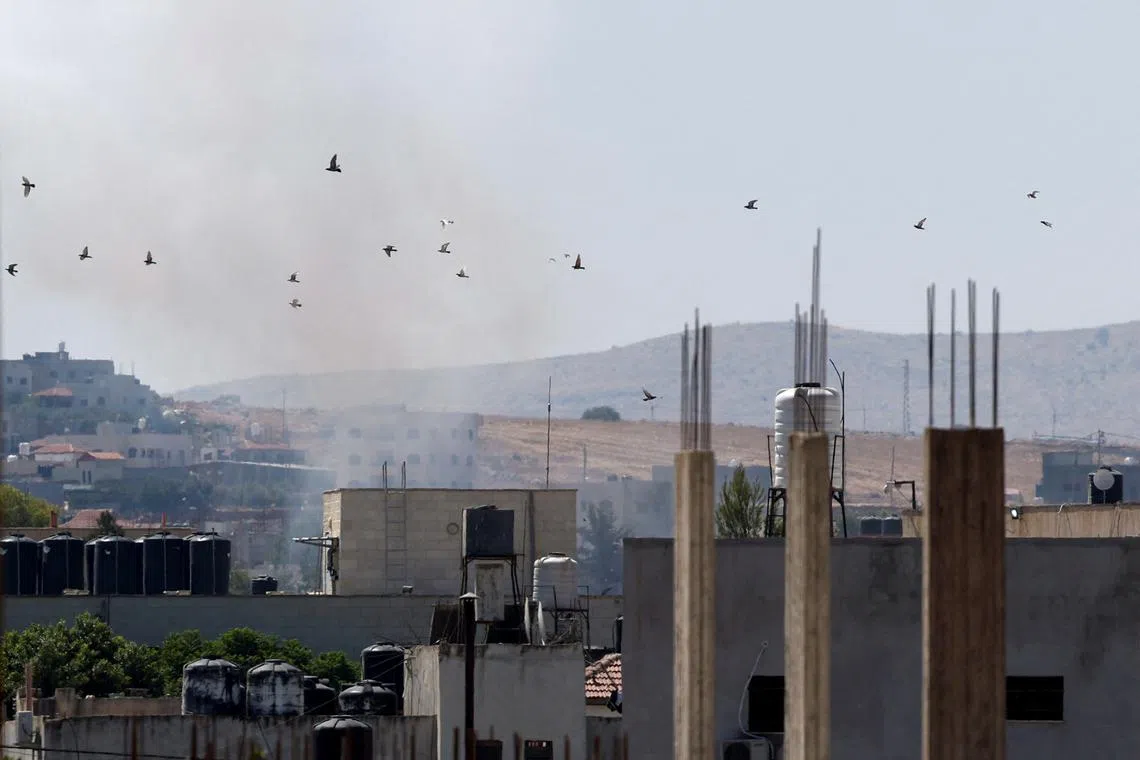 Birds fly during an Israeli raid, in Tubas, in the Israeli-occupied West Bank, August 14, 2024. REUTERS/Raneen Sawafta