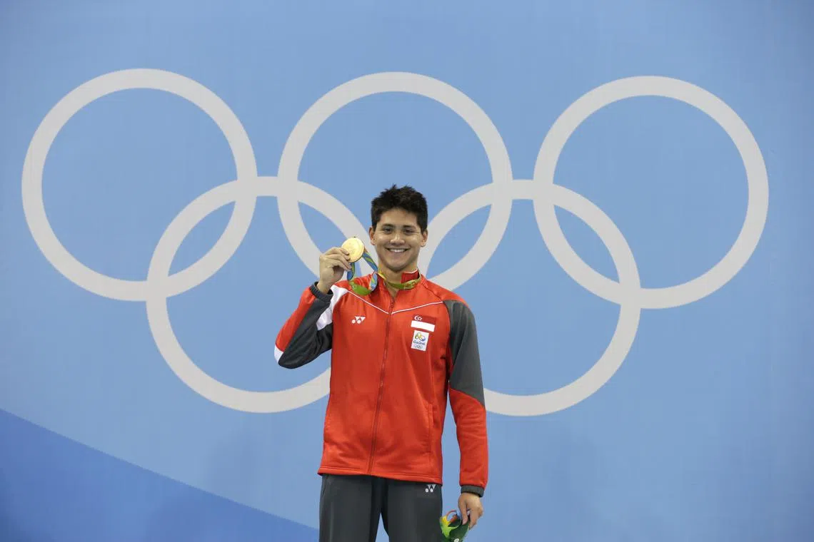 Joseph Schooling of Singapore with the gold medal on the podium after winning the Rio 2016 Olympic Games men's 100m butterfly final at the Olympic Aquatics Stadium in Rio de Janeiro, Brazil, on Aug 12, 2016.