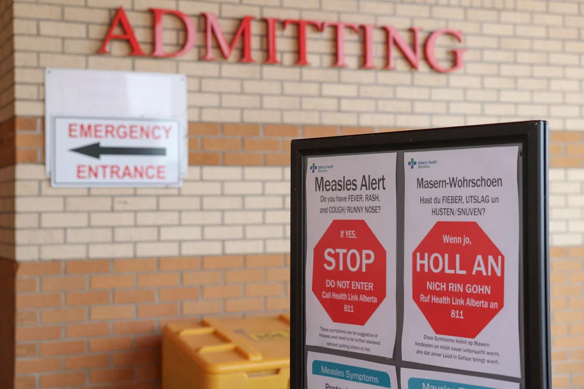 Healthy awareness posters related to the measles outbreak during a public health awareness campaign, at the Taber Health Centre, in the largely Mennonite community of Taber, Alberta, Canada, October 27, 2025. REUTERS/Ahmed Zakot
