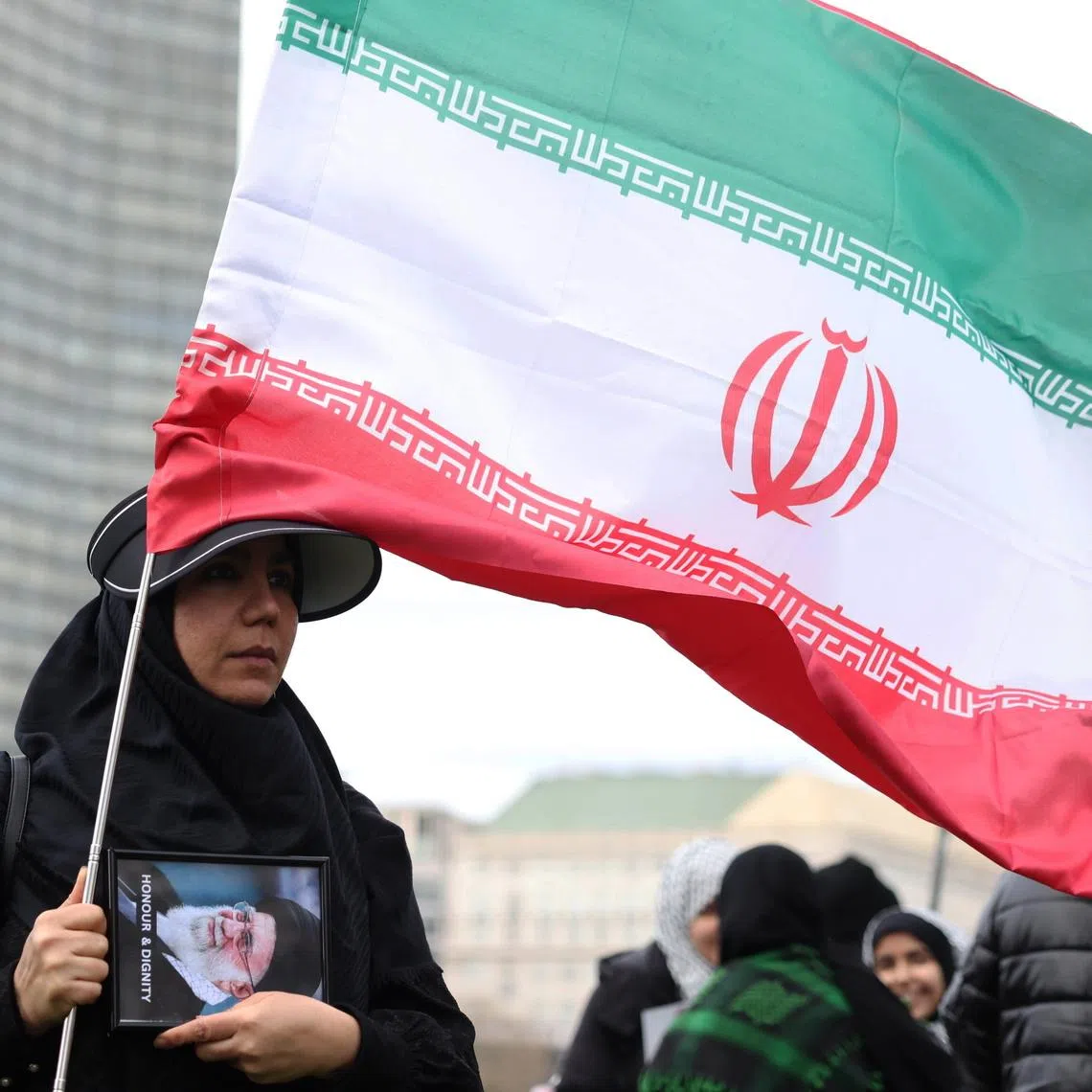 A protester holds an image of former leader of Iran Ali Khamenei as they gather to mark Al Quds Day in London, Britain, on March 15.