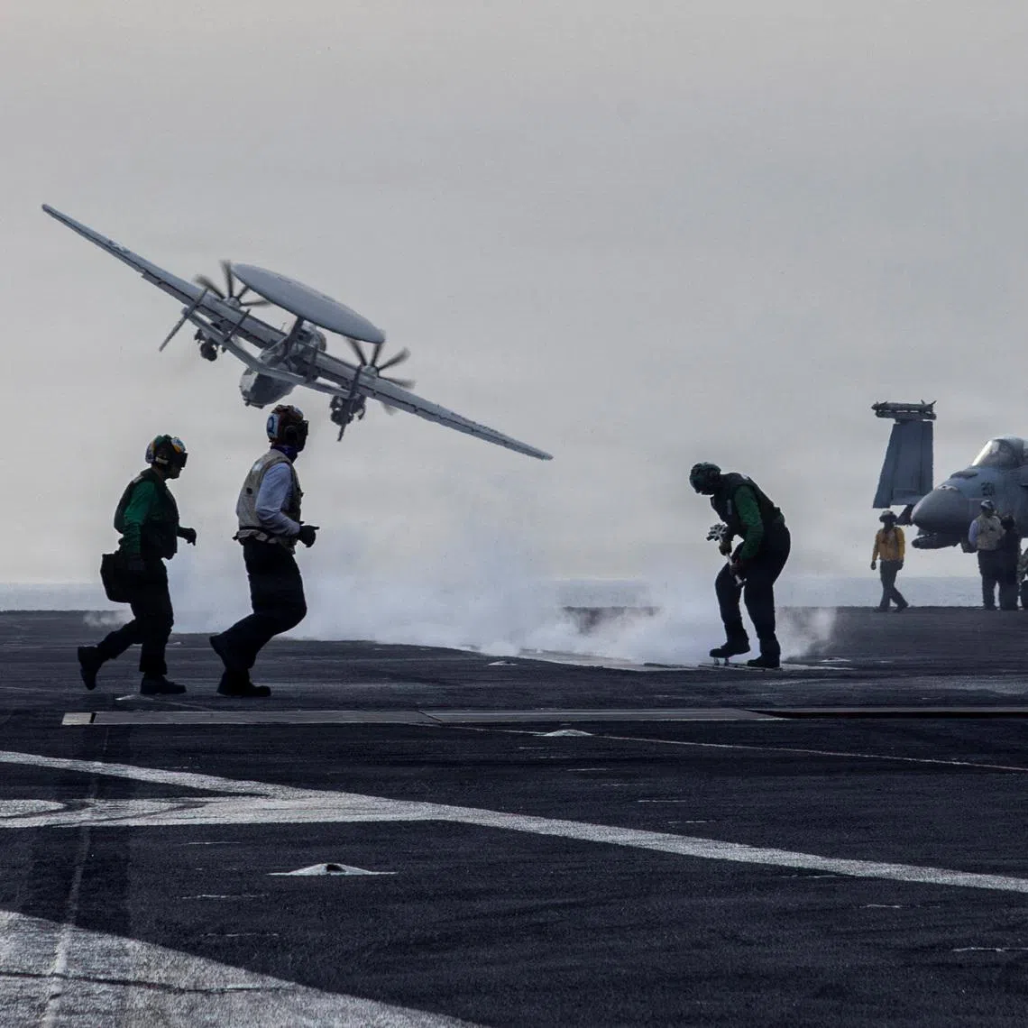 An E-2D Hawkeye surveillance aircraft launches from the flight deck of the U.S. Navy Nimitz-class aircraft carrier USS Abraham Lincoln during thge Operation Epic Fury attack on Iran March 31, 2026.