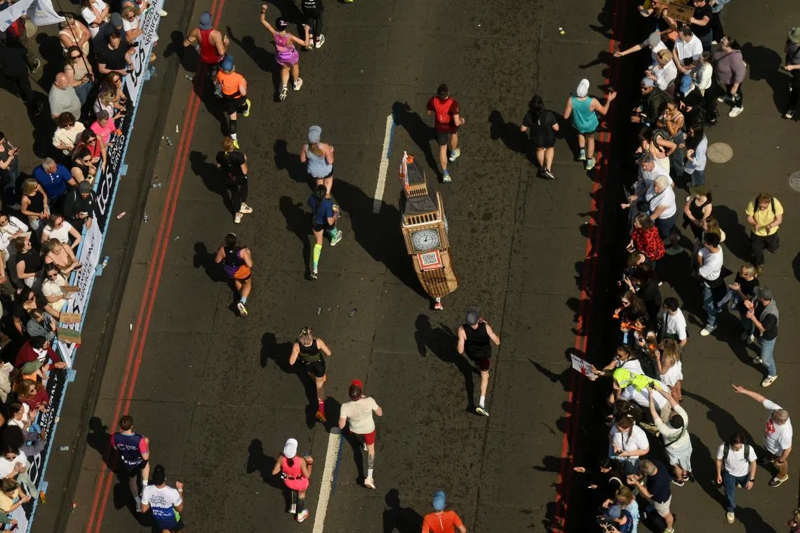 Athletics - London Marathon - London, Britain - April 27, 2025 A runner in fancy dress as they run over Tower Bridge during the London Marathon REUTERS/Jaimi Joy