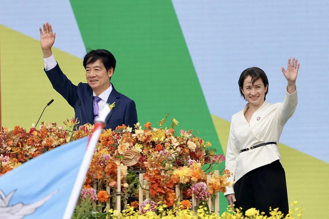 epa11354633 Taiwan President William Lai (Lai Ching-te) (L) and Vice President Hsiao Bi-khim (R) wave to the crowd during the Taiwan Presidential Inauguration, in Taipei, Taiwan, 20 May 2024. William Lai (Lai Ching-te) became Taiwan's 16th president on 20 May, taking over incumbent Tsai Ing-wen.  EPA-EFE/RITCHIE B. TONGO