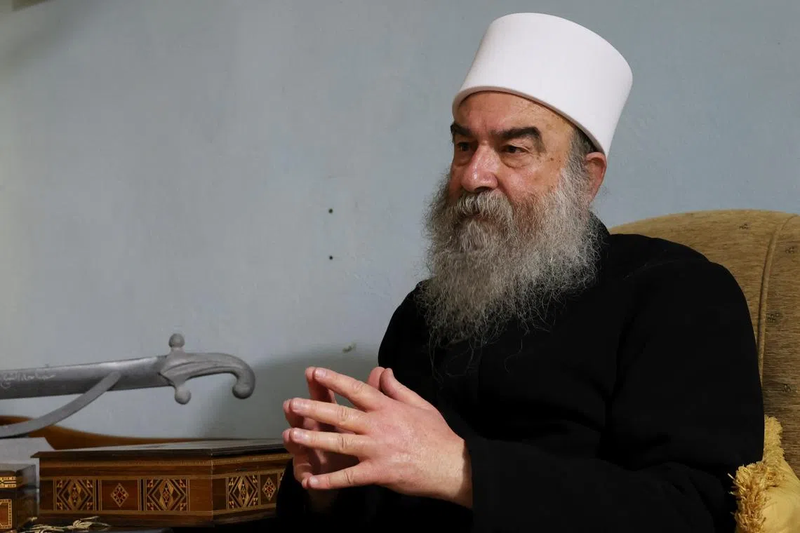 FILE PHOTO: Syrian Druze leader Sheikh Hikmat al-Hajri attends an interview with Reuters in Sweida, Syria February 20, 2025. REUTERS/Yamam Al Shaar/File photo