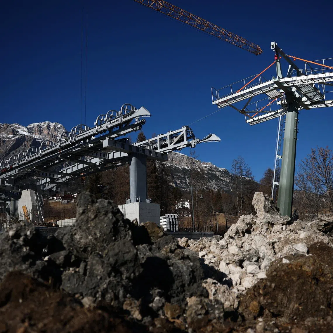 Work on the system, designed to take spectators from the town centre directly to the slopes, began behind schedule.