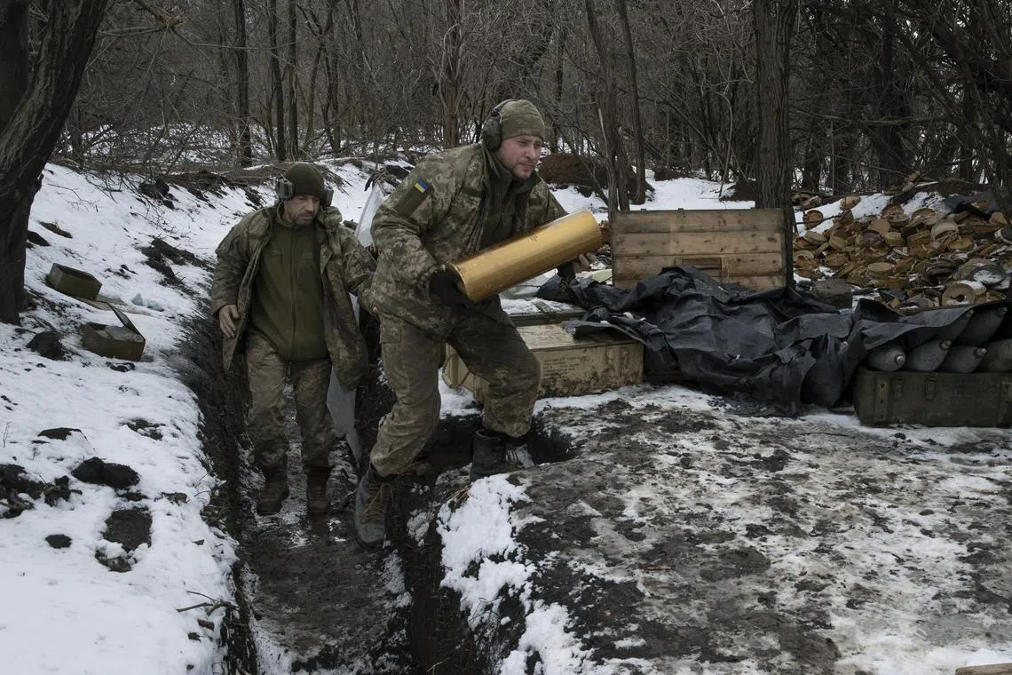 FILE — Soldiers with the Ukrainian armed forces fire a Howitzer at Russian positions, in the Donbas Region of eastern Ukraine, on Feb. 14, 2023. The U.S. has changed how it uses intelligence over the course of the war in Ukraine. (Tyler Hicks/The New York Times)