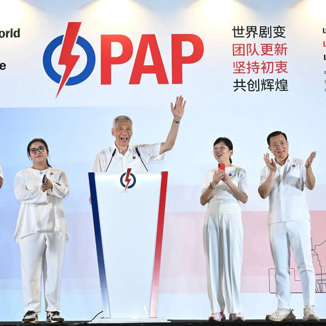 Senior Minister Lee Hsien Loong (centre) greeting supporters at Yio Chu Kang Stadium on Polling Day. With him are his fellow Ang Mo Kio GRC candidates (from left) Darryl David, Nadia Ahmad Samdin, Jasmin Lau and Victor Lye.