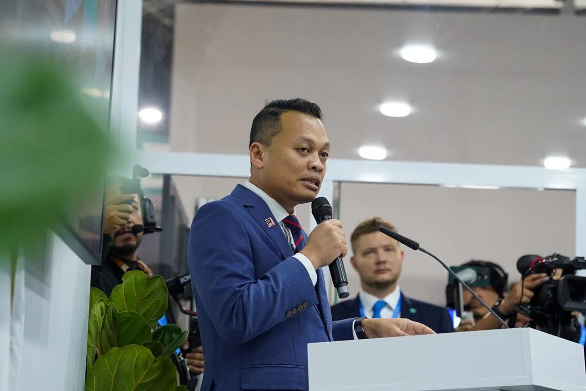 Malaysia's Minister of Natural Resources and Environmental Sustainability Nik Nazmi Nik Ahmad at the COP29 Malaysia pavilion. 