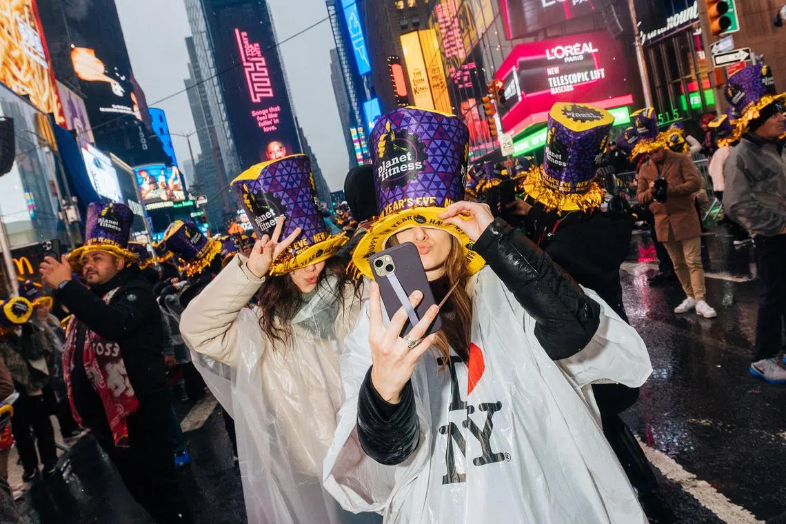 Revellers gather near Times Square in Manhattan while waiting for New Years Eve celebrations to commence, in New York on Saturday, Dec 31, 2022. It was not just the streets of Times Square that were packed during the holidays: Broadway’s theatres had their best week since the arrival of the coronavirus. 