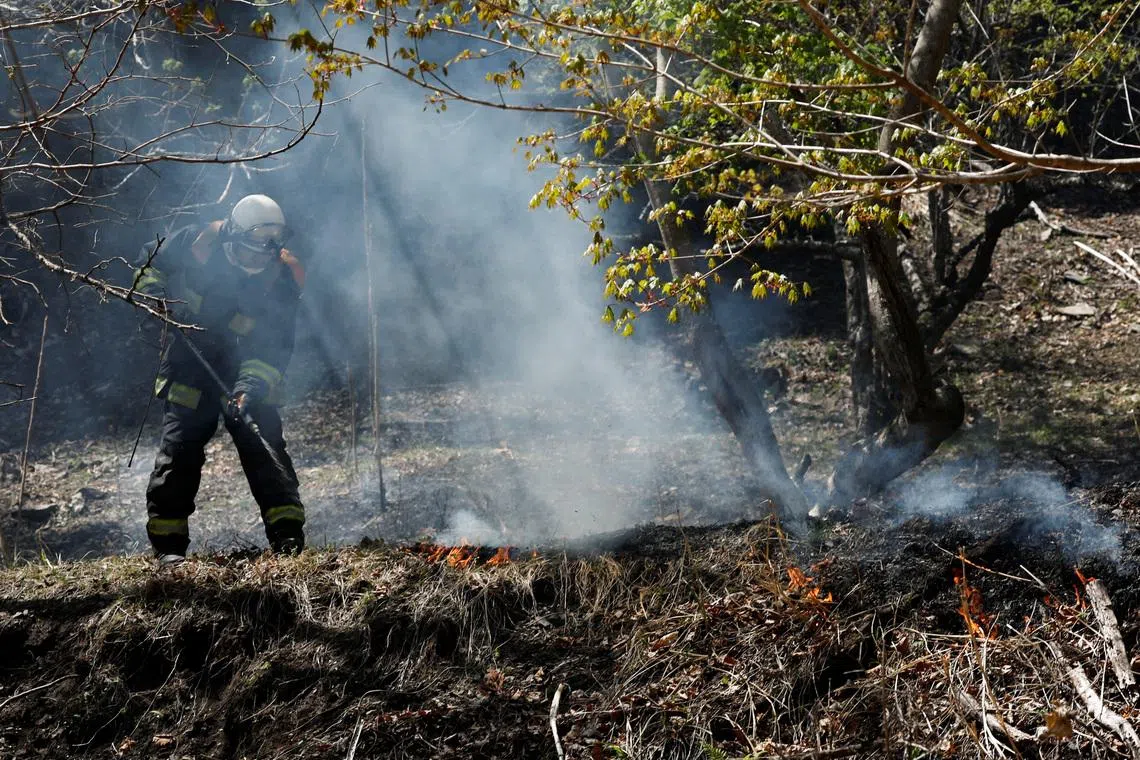 A firefighter works as wildfires continue in Otsuchi, Iwate Prefecture, Japan, April 26, 2026. REUTERS/Kim Kyung-Hoon