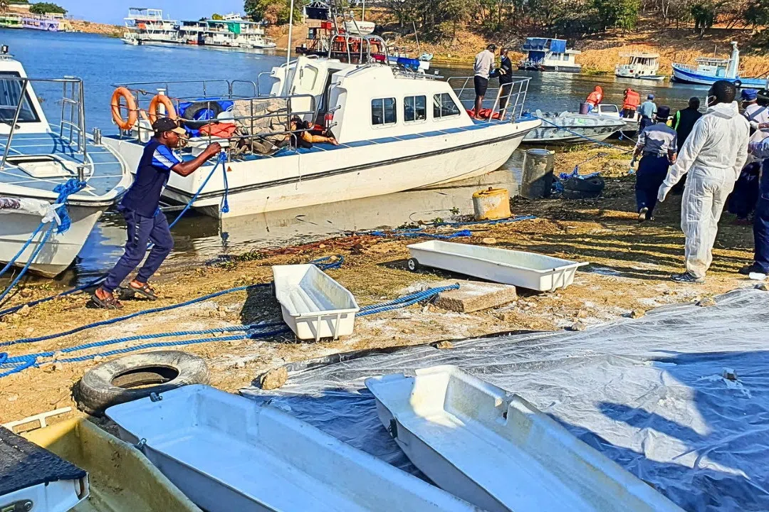 SENSITIVE MATERIAL. THIS IMAGE MAY OFFEND OR DISTURB Rescue and recovery personnel work along the shoreline of Lake Kariba during an operation to recover victims from a Rural Infrastructure Development Agency (RIDA) passenger ferry that capsized near Kariba, Zimbabwe, August 17, 2026.  REUTERS/Bright Charakupa