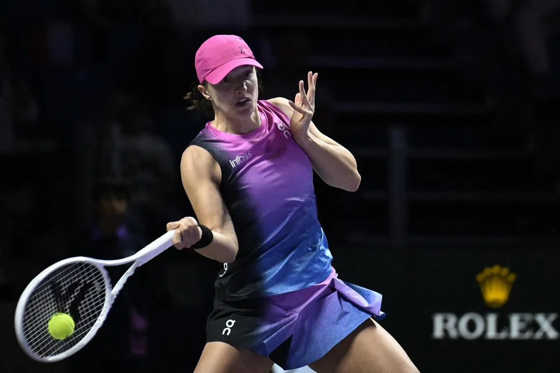 Iga Swiatek returning to Barbora Krejcikova during their WTA Finals match in Riyadh on Nov. 3. 