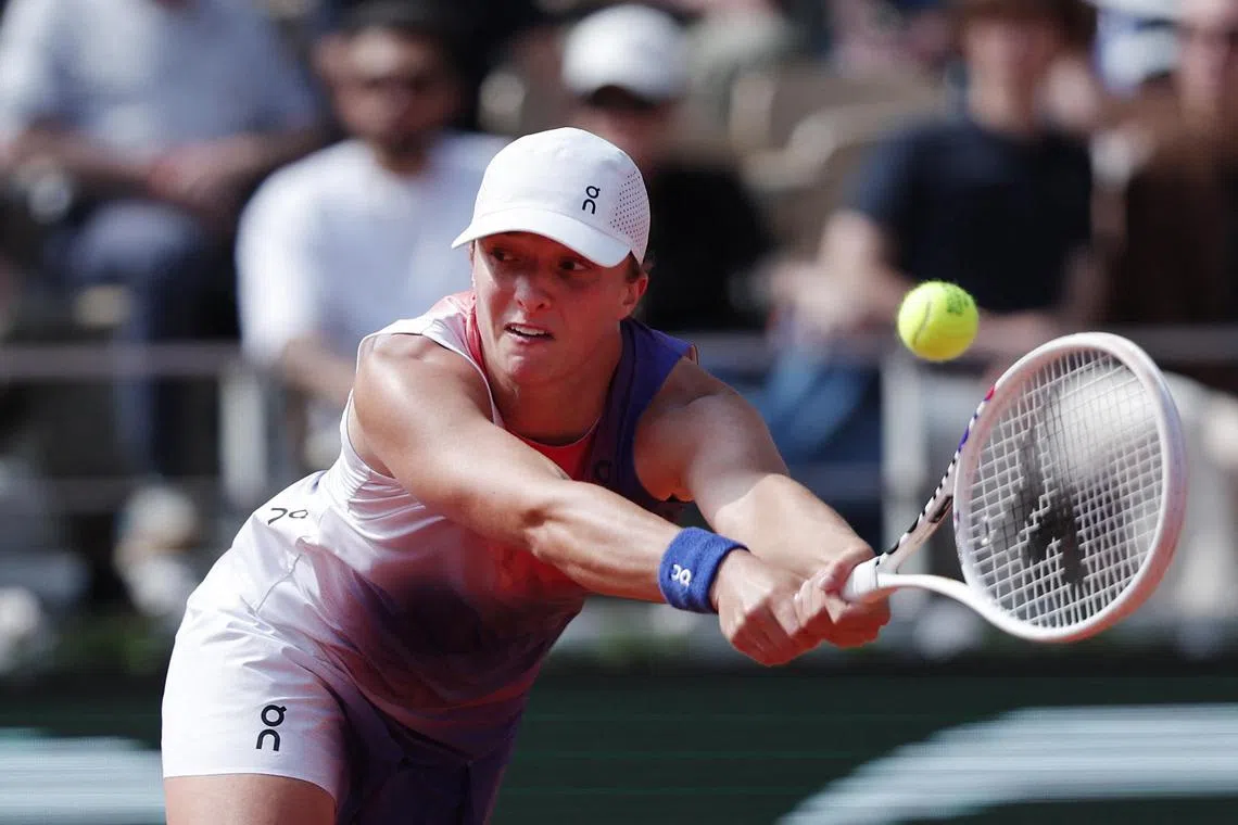 World No. 1 Iga Swiatek hitting the ball in her French Open semi-final clash with American Coco Gauff.