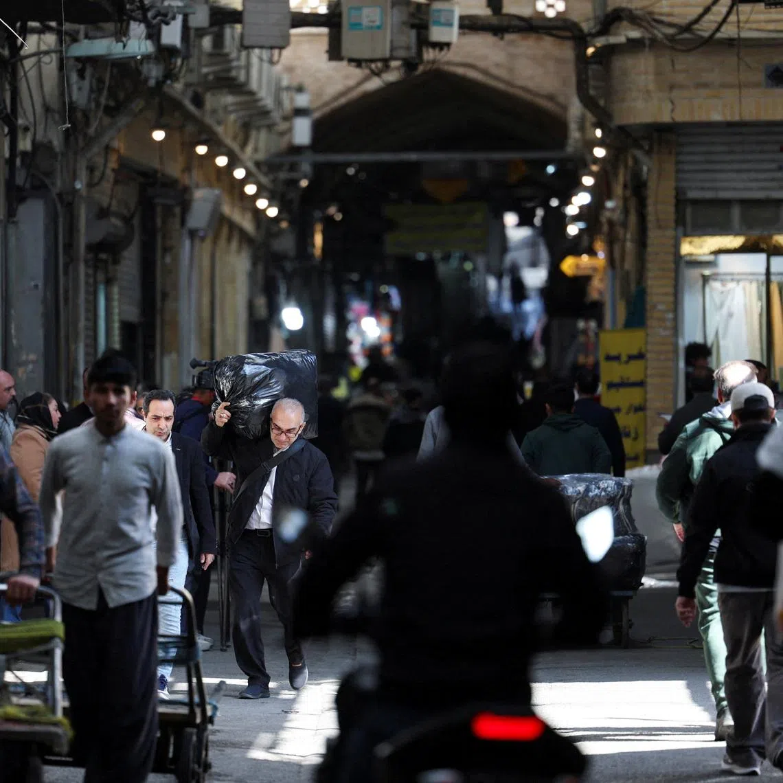 People visit the Grand Bazaar, ahead of the Iranian New Year, amid the U.S.-Israeli conflict with Iran, in Tehran, Iran, March 18, 2026. REUTERS/Alaa Al Marjani