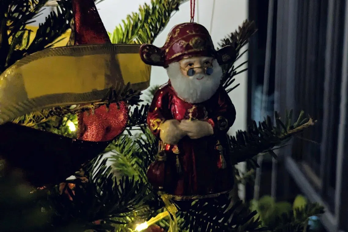 The only plausible reason for an ornament that looks like a cross between Caishen and Santa Claus is to prolong the life of the Christmas tree.