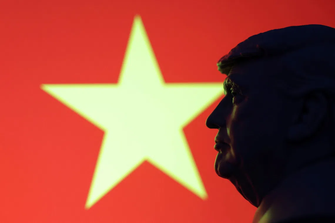 A 3D-printed miniature model of U.S. President Donald Trump and the Vietnam flag are seen in this illustration taken July 23, 2025. REUTERS/Dado Ruvic/Illustration