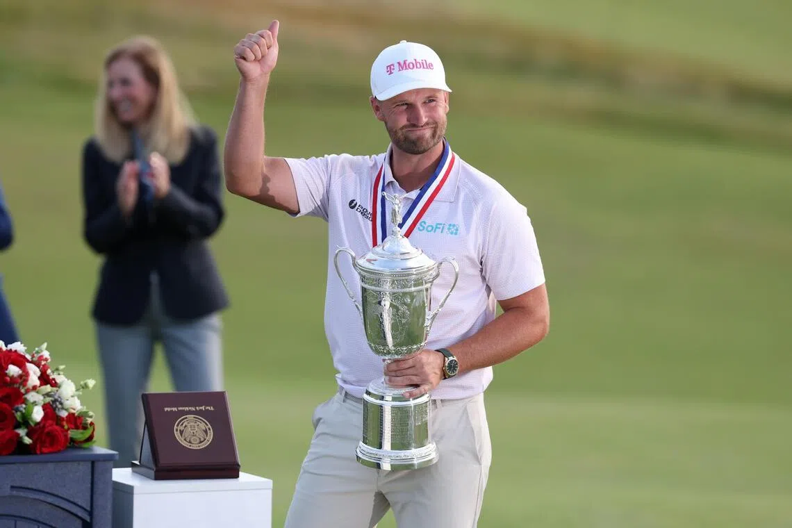 Wyndham Clark celebrating with the trophy after winning the US Open golf tournament at the Shinnecock Hills Golf Club in Southampton, New York, on June 21.
