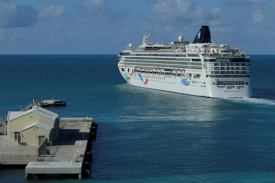 FILE PHOTO: The cruise ship of the Norwegian Cruise Line 'Norwegian Dawn\" departs the Royal Naval Dockyard July 16, 2013 near the port of Hamilton, Bermuda.  REUTERS/Gary Cameron