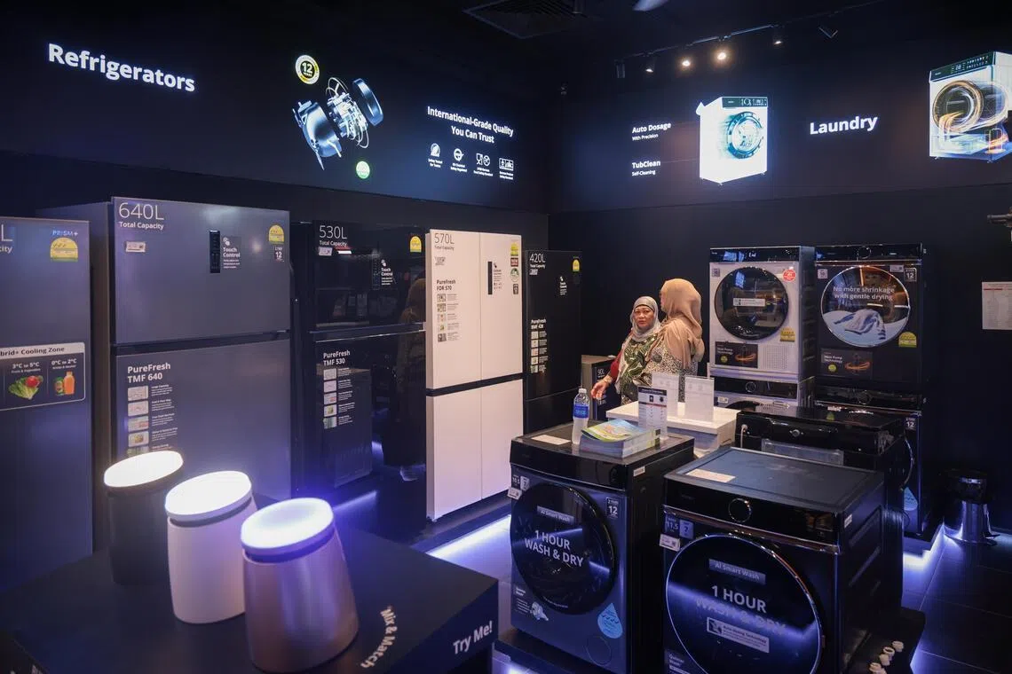Customers at Prism+’s relaunched Suntec City store.