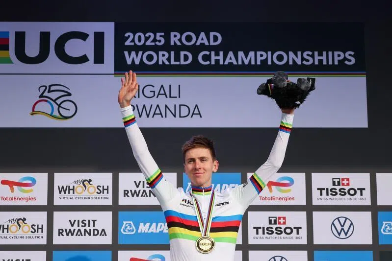 Gold medallist Slovenian rider Tadej Pogacar poses on the podium after winning the Men's Elite Road Race on Sept 28. 