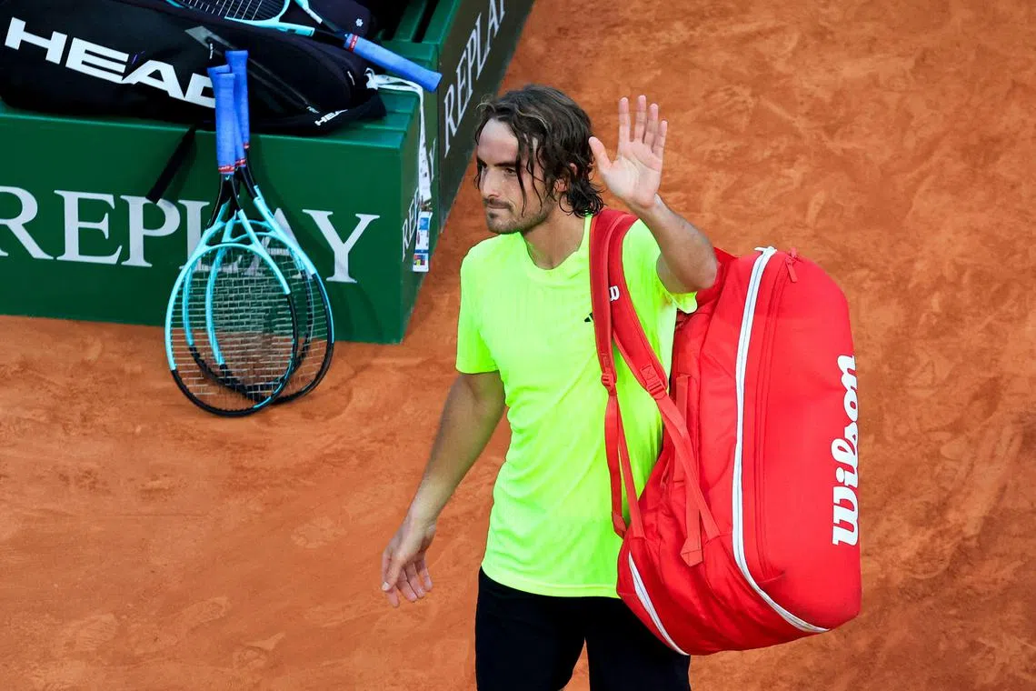 Greece's Stefanos Tsitsipas leaving the court after losing to Italy's Lorenzo Musetti.
